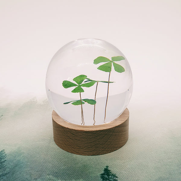 Lucky Clovers Embedded in Resin Globe on Stand
